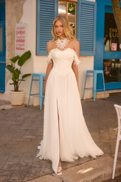 A-line chiffon wedding dress with lace halter collar, off-shoulder lace cuffs, ruched sweetheart bodice, and front slit skirt.
