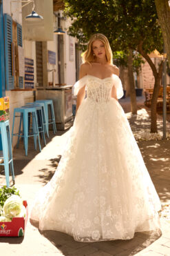 Ball gown wedding dress with sheer corset bodice, off-the-shoulder tulle sleeves, and floral lace skirt.