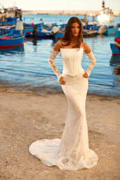 Mermaid wedding dress with strapless satin corset bodice, floral lace skirt, lace-up back, and long lace gloves.