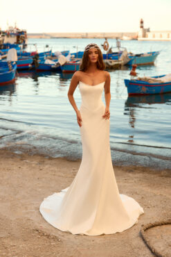 Mermaid wedding dress with sheer floral lace high neck and long sleeves over a smooth crepe skirt with chapel train.